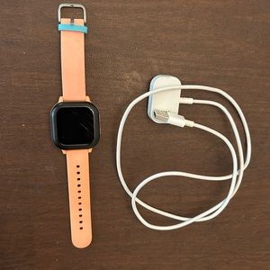 Gizmo watch and charger. Color:peach and black.